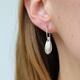 Earrings made by Sarah Smuts-Kennedy of Tāmaki Makaurau, Aotearoa