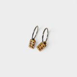 Earrings made by Sarah Smuts-Kennedy of Tāmaki Makaurau, Aotearoa