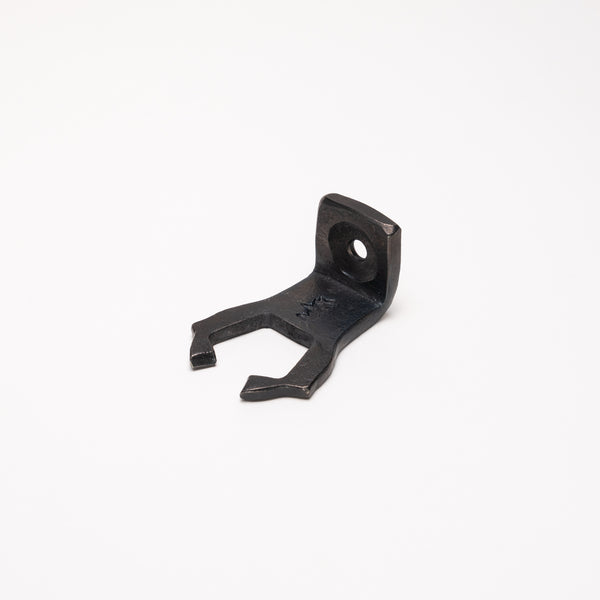 Bracket for fire poker made in Darfield, Aotearoa