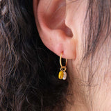 Kōwhai pearl sleepers in gold by Avara Studio made in Tāmaki Makaurau, Aotearoa