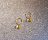 Kōwhai pearl sleepers in gold by Avara Studio made in Tāmaki Makaurau, Aotearoa