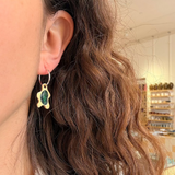 Earrings made by Sarah Smuts-Kennedy of Tāmaki Makaurau, Aotearoa