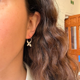Earrings made by Sarah Smuts-Kennedy of Tāmaki Makaurau, Aotearoa