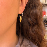 Earrings made by Sarah Smuts-Kennedy of Tāmaki Makaurau, Aotearoa