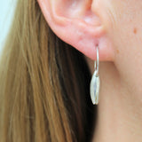 Earrings made by Sarah Smuts-Kennedy of Tāmaki Makaurau, Aotearoa