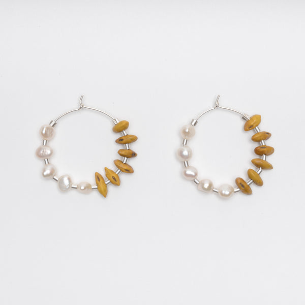 Kōwhai pearl hoops by Avara Studio made in Tāmaki Makaurau, Aotearoa