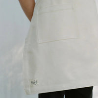 Cream denim apron made by M.N Uniform in Northland, Aotearoa