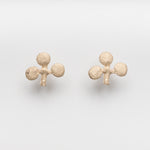 Pure gold club studs by Hannah Upritchard