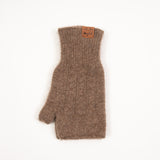 Brown pihepe cable knit fingerless mitten with a leather Wyld tag, laid flat