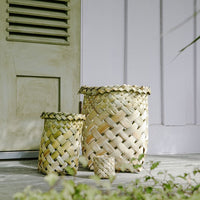 Waikawa baskets in three sizes, on a deck. 