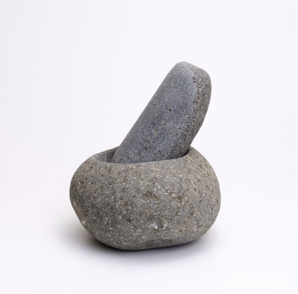 Mortar and pestle hand carved from volcanic andesite rock