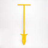 Yellow metal T bar spade with pointed digging end. 